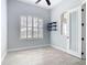 Office with shuttered window, modern ceiling fan and decorative shelving at 12605 Bacchus Rd, Port Charlotte, FL 33981