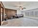 Spacious basement area with wood paneling, storage cabinets, and lots of natural light at 13 Caddy Rd, Rotonda West, FL 33947
