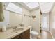 Bright bathroom with a large mirror, tiled floors, and decor to provide a relaxing and spa-like feel at 13 Caddy Rd, Rotonda West, FL 33947