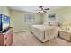 Cozy bedroom features a comfortable bed, neutral decor, and lots of natural light at 13 Caddy Rd, Rotonda West, FL 33947