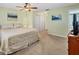 Bedroom featuring a comfortable bed, neutral decor, and a view of a well-organized closet at 13 Caddy Rd, Rotonda West, FL 33947