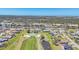 Community with views of a golf course, a canal, and residential homes at 13 Caddy Rd, Rotonda West, FL 33947