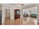 Open concept dining area with wood-look flooring, china cabinet, and adjacent living space at 13 Caddy Rd, Rotonda West, FL 33947