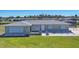 Charming single-story home with well-maintained lawn and stone-accented landscaping at 13 Caddy Rd, Rotonda West, FL 33947