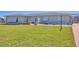 Charming home with a well-manicured lawn and cozy front porch entrance at 13 Caddy Rd, Rotonda West, FL 33947
