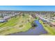 Stunning aerial view of a golf course and residential community at 13 Caddy Rd, Rotonda West, FL 33947