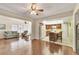 Open concept space with tile flooring, kitchen bar and lounge area at 13 Caddy Rd, Rotonda West, FL 33947