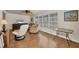Bright living room featuring stylish furniture, light walls, and a beautiful parquet floor pattern at 13 Caddy Rd, Rotonda West, FL 33947