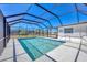 Screened pool with a covered enclosure allows for year-round enjoyment at 13 Caddy Rd, Rotonda West, FL 33947