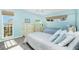 Bedroom features two twin beds, light blue walls, carpeted floor and a window with exterior views at 1401 Beach Rd # 304, Englewood, FL 34223