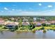 Aerial view of community featuring lakefront properties, mature trees and serene landscaping at 14236 Silver Lakes Cir, Port Charlotte, FL 33953