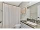 Neutral bathroom with stone countertop vanity and shower with curtain at 14236 Silver Lakes Cir, Port Charlotte, FL 33953
