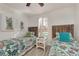 Bedroom with twin beds and bright tropical decor at 14236 Silver Lakes Cir, Port Charlotte, FL 33953