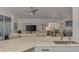 Marble kitchen island overlooks a living area with natural light and ceiling fan at 14236 Silver Lakes Cir, Port Charlotte, FL 33953