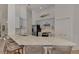 Contemporary kitchen featuring a large marble island with seating and stainless steel appliances at 14236 Silver Lakes Cir, Port Charlotte, FL 33953