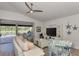 Open living area featuring a large sectional sofa and a backyard lanai at 14236 Silver Lakes Cir, Port Charlotte, FL 33953