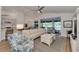 Spacious open-concept living area with kitchen and lanai views, perfect for entertaining at 14236 Silver Lakes Cir, Port Charlotte, FL 33953