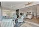 The light-filled sunroom has comfortable seating and a seamless transition to the home's interior, perfect for relaxation at 14236 Silver Lakes Cir, Port Charlotte, FL 33953