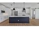 Modern kitchen featuring an island, pendant lighting, and stainless steel appliances at 14246 Maysville, Port Charlotte, FL 33981