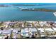 Waterfront homes with docks and boat lifts along the canal offer easy access to boating and water activities at 1432 Lemon Bay Dr, Englewood, FL 34223