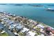 Waterfront homes with docks and boat lifts along the canal offer easy access to boating and water activities at 1432 Lemon Bay Dr, Englewood, FL 34223
