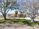 Quaint, single story home surrounded by beautiful mature trees at 1432 Lemon Bay Dr, Englewood, FL 34223