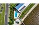 Aerial showcasing community pool, beach access, fishing pier, and adjacent highway at 14459 River Beach Dr # 129, Port Charlotte, FL 33953
