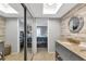 En suite bathroom features double sink vanity and access to bedroom with sliding doors at 14459 River Beach Dr # 129, Port Charlotte, FL 33953