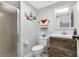 Bathroom features a walk-in shower, a stylish vanity, and an integrated commode and sink at 14459 River Beach Dr # 129, Port Charlotte, FL 33953