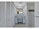Hallway features built-in desk area, storage, and view into the adjacent living area at 14459 River Beach Dr # 129, Port Charlotte, FL 33953