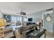 Comfortable living room featuring tile floors, plush sofa, and ocean views at 14459 River Beach Dr # 129, Port Charlotte, FL 33953