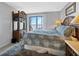 Main bedroom has a balcony slider and is decorated with coastal furnishings and decor at 14459 River Beach Dr # 129, Port Charlotte, FL 33953