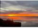 Stunning sunset view from the screened balcony, offering a tranquil escape at 14459 River Beach Dr # 129, Port Charlotte, FL 33953