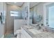 Modern bathroom with a marble countertop, framed mirror, and a glass-enclosed shower with mosaic tile at 15342 Aron, Port Charlotte, FL 33981