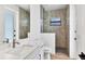 Modern bathroom featuring a white vanity, tiled shower, and contrasting hardware at 15342 Aron, Port Charlotte, FL 33981