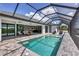 Relaxing screened pool area with comfortable outdoor seating and seamless indoor-outdoor flow at 15342 Aron, Port Charlotte, FL 33981