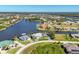 A waterfront community with beautiful single-Gathering homes, canals, and manicured landscaping at 15498 Seafoam Cir, Port Charlotte, FL 33981