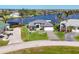 Inviting single-story home with a well-maintained lawn and waterfront views at 15498 Seafoam Cir, Port Charlotte, FL 33981
