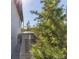 Image features a generator surrounded by green shrubbery next to a gray house at 15498 Seafoam Cir, Port Charlotte, FL 33981