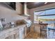 A fully-equipped outdoor kitchen including granite counters and stainless steel appliances at 15498 Seafoam Cir, Port Charlotte, FL 33981