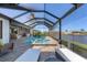 Inviting pool and spa in screened lanai, with ample seating, creating a private outdoor oasis at 15498 Seafoam Cir, Port Charlotte, FL 33981