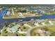Aerial view of waterfront homes in a picturesque community with canal access at 15690 Viscount Cir, Port Charlotte, FL 33981