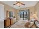 Comfortable bedroom with natural light and outdoor access, ideal for relaxation and enjoying the scenic views at 15690 Viscount Cir, Port Charlotte, FL 33981
