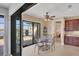 Bright dining area adjacent to kitchen, offering serene water views through sliding glass doors at 15690 Viscount Cir, Port Charlotte, FL 33981