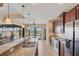 Spacious kitchen boasts granite countertops, stainless steel appliances, and picturesque views at 15690 Viscount Cir, Port Charlotte, FL 33981