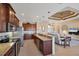 Open kitchen featuring stainless steel appliances, granite counters, and seamless flow to living area at 15690 Viscount Cir, Port Charlotte, FL 33981