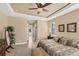 Comfortable main bedroom, features tray ceilings and ample space, creating a serene retreat at 15690 Viscount Cir, Port Charlotte, FL 33981