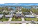 Aerial view of the home showing the neighborhood and water views at 1694 Harbor W Cir, Largo, FL 33770