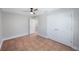 Comfortable bedroom with tile flooring, ceiling fan, and closet space at 1694 Harbor W Cir, Largo, FL 33770