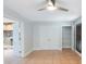 Bright room featuring a fireplace, closet, and shutter doors at 1694 Harbor W Cir, Largo, FL 33770